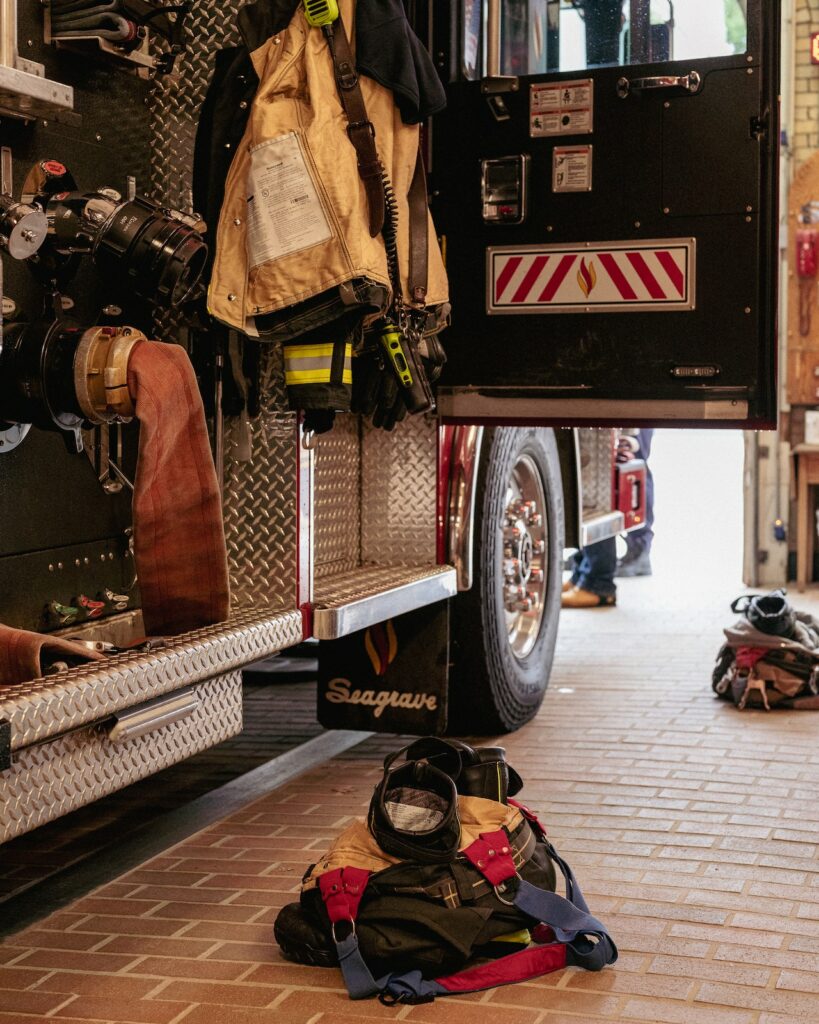 firetruck with doors open and equipment strewn around